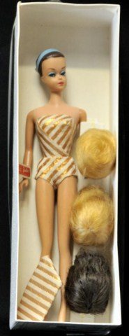 1963 Fashion Queen Barbie w/ Three Wigs: Fashion Queen Barbie with molded painted hair and blue vinyl headband, color magic face, wearing gold and white striped swimsuit and matching turban scarf, three wigs on wig stand