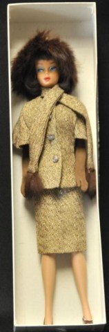 1965 Am. Girl Barbie "Gold 'N Glamour" #1647: Long dark brown hair and suntan face color, wearing "Gold 'N Glamour" #1647 consisting of dress with turquoise chiffon bodice and tweed skirt, tweed cape sleeve jacket with fur trimmed attached scarf,