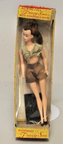 7 1/2" Hong Kong Lilli "Tracy Sue" Doll: 7 1/2" "Glamorous Tracy Sue" doll in original box; brunette wearing brown shorts and green blouse tied to expose midriff; box with small tears and minor wear, cracks to plastic cover