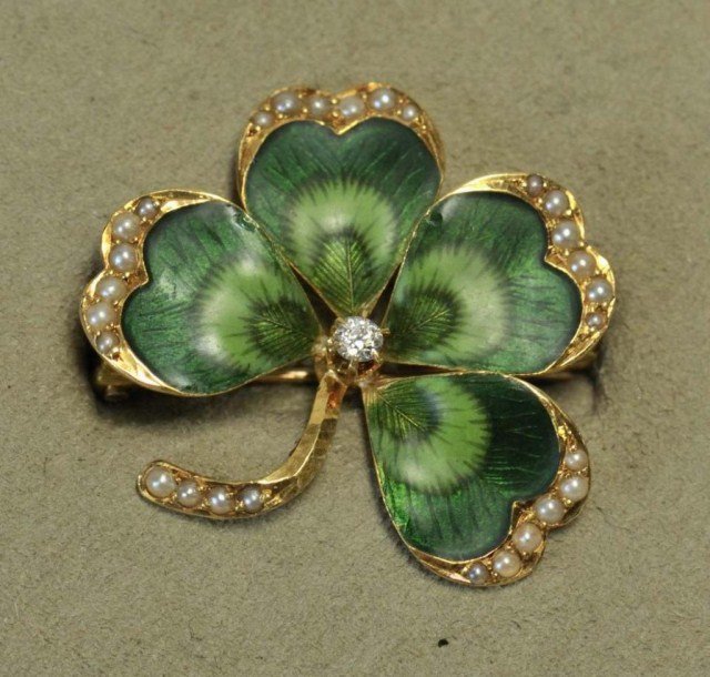 14K Gold Four Leaf Clover Brooch: Stamped "14K" yellow gold and enamel four-leaf clover brooch with center diamond, seed pearl accents on edges and stem; approximately 1" x 1"; .115 ozt