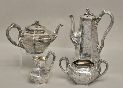 Four Piece Irish Silver Tea & Coffee Service: Marks for Dublin, 1846, maker John Smith (Smyth); six-paneled bodies, each panel with chased floriated design, one side depicting deer in medallion; branch form handles; coffeepot and teapot with ivor