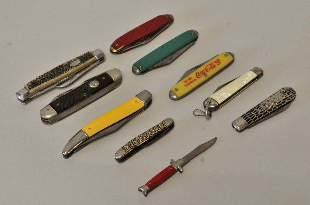 Collection of Ten Knives: Nine pockets knives and one 3 7/8" knife; pocket knives include Coca-Cola advertising knife and others marked Imperial, USA, Ulster, I.K. Co., Pakistan, China; two with broken blades