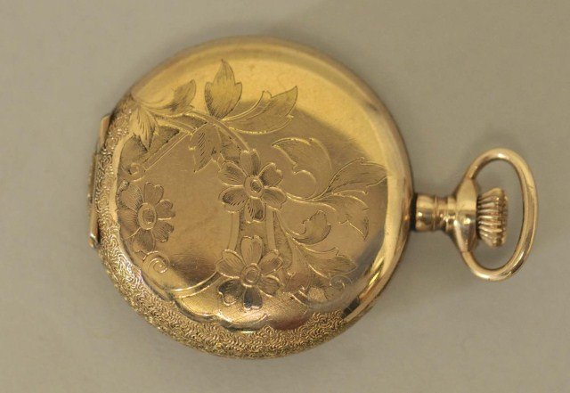 Imperial Lady's Pocket Watch: Gold filled hunter case engraved with floral design both sides and marked "Illinois Watch Case Co. Elgin Napoleon 2510752"; works marked "Swiss Buren Watch Co. Imperial C31542", seven jewels, pink and