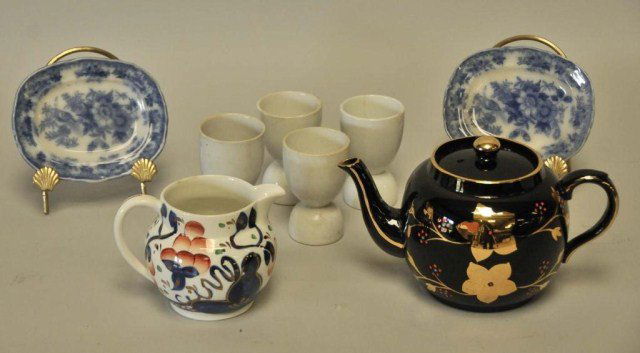 Lot of Miscellaneous Serving Items: 1. English "Old Castle" pitcher decorated in cobalt blue and red, 4"H; 2. English Price Bros. teapot with gilt and enamel decoration, 5"H; 3. Four stoneware egg cups, 3 3/4"H; discoloration, one with