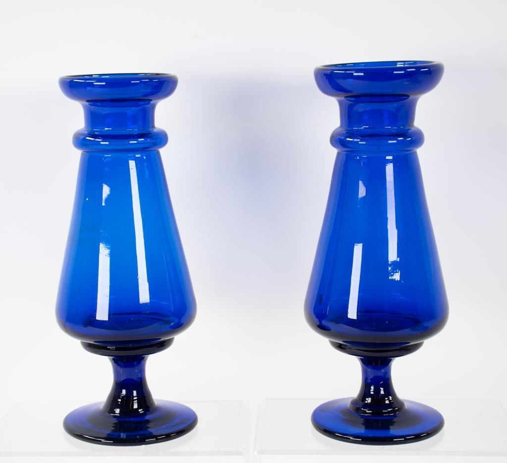 Pair of Blown Glass Hyacinth Vases: Deep translucent cobalt blue, each of baluster form with cupped rim and neck ring, raised on a short stem with circular foot, polished pontil mark, probably second half 19th century; 8 3/4"H and 8 7/8