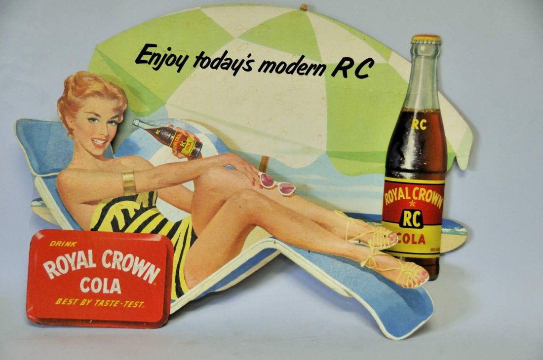Rare Royal Crown RC Cola Dimensional Die-Cut Sign: Cardboard dimensional beach scene cutout comprised of two separate pieces, top piece features a young woman in bathing suit lounging in beach chair and drinking a bottle of Royal Crown RC Cola, back o