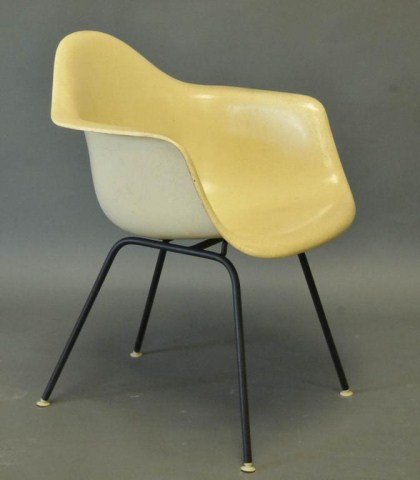 Charles & Ray Eames / Herman Miller Chair: Fiberglass shell armchair, Herman Miller paper label; 31 1/4"H, 24 1/2"W, 25"D, seat height 17 1/2"; discoloration/soiling to arms, seat, and around edges