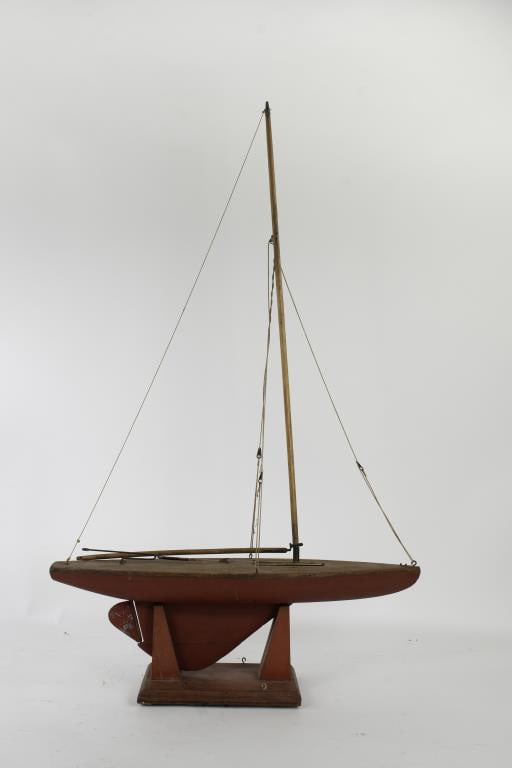 Vintage Hand Built Pond Boat: Early 20th century, hand built and painted pond boat with a weighted lead keel and functioning rudder / tiller, no sails; 21 1/2"L, 35"H---This lot does not qualify for in-house shipping. Customer pic