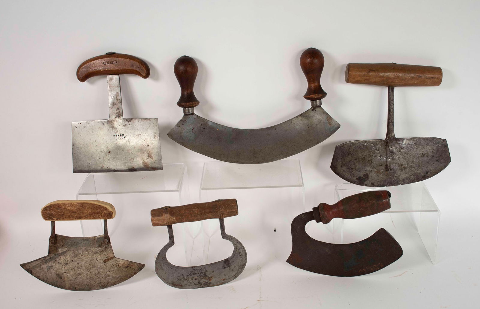 Lot of Early Food Choppers: Lot of six 19th century wrought iron food choppers, five with turned or carved wooden handles and one with a carved bone handle, one having a blade stamped "Henry Bilcock (?)" with a handle stamped "I