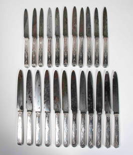 Christofle Silverplate Cutlery: Set of twelve 9 3/4" and eleven 8" silverplate knives with steel blades, blades marked "Christofle / A Paris", unknown pattern---some blades with corrosion---From the estate of Joseph Ewing, long-time