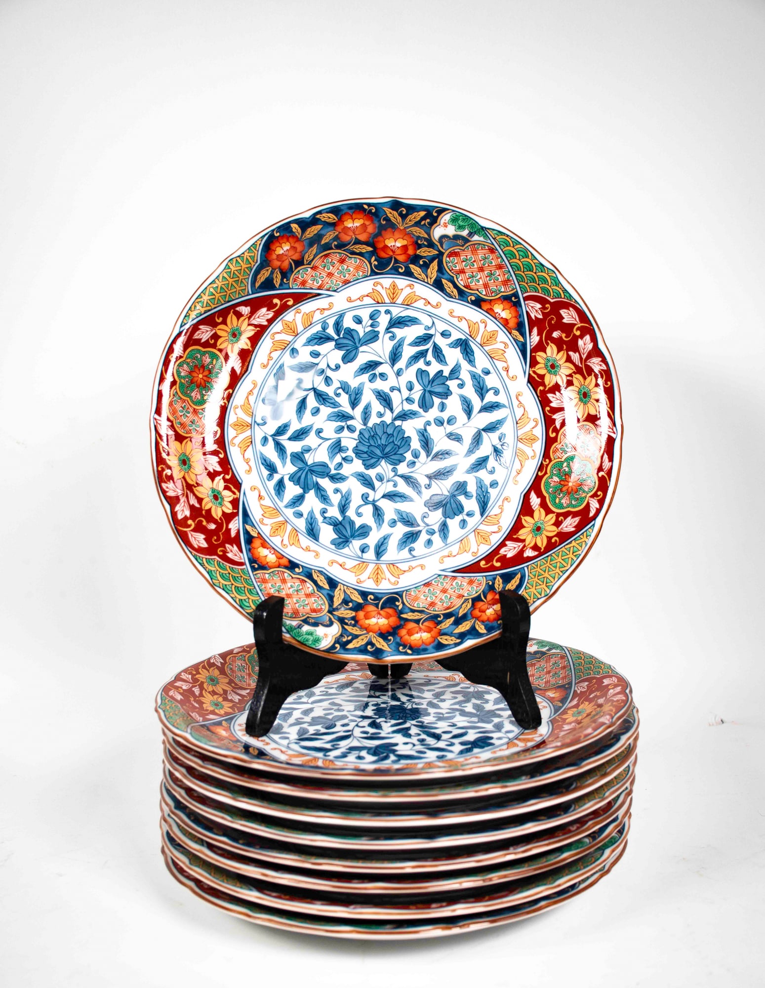 Set of 9 Japanese Chikusai Kiln Imari Plates: 10 1/4" dia., each marked on base; one plate with minor chip to edge of rim---From the estate of Joseph Ewing, long-time antiques dealer in OH, NC, and SC, to benefit the Laurens County Museum Associa