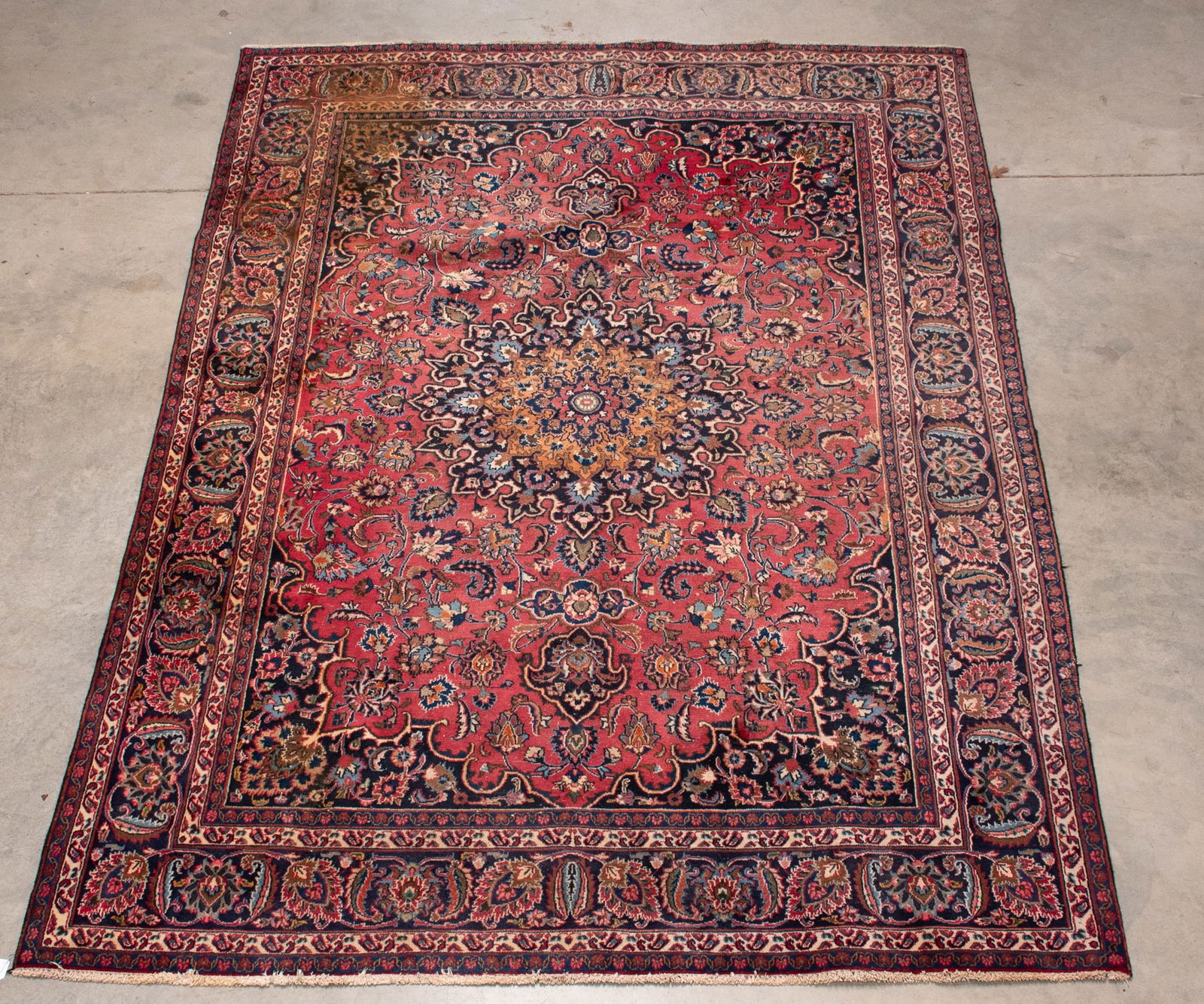 Persian Rug, 7'8"W, 11'2"L: Central medallion and flowering vines on a salmon ground, "Made in Iran" tag; 7'8"W, 11'2"L; low-medium pile, scattered wear with some corduroy effect, needs cleaning (Inv. 38)