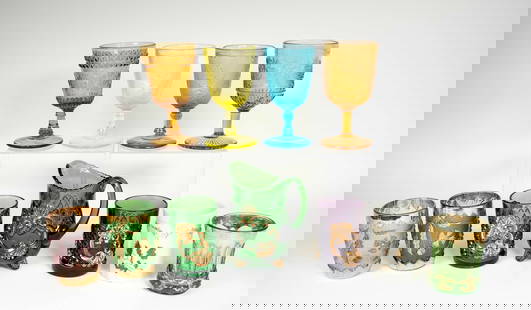 Pressed Glass Tumblers, Goblets, Creamer: Lot of eleven, various makers: Two Rose in Snow goblets, one vaseline (black lighted) and one blue; 5 3/4"H---Wildflower amber goblet; 5 7/8"H---Hummingbird amber goblet; 6"H---Northwood paneled Chrys