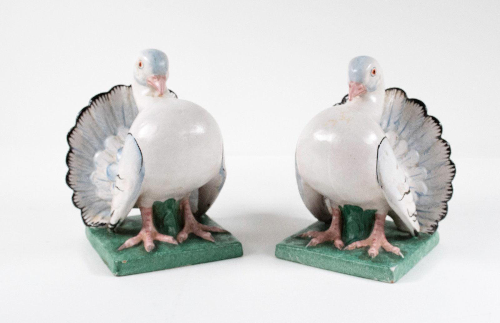 Ugo Zaccagnini Italian Pottery Dove Bookends: Pair of bookends depicting painted figures of doves in a strutting posture with puffed-out chests, signed on base "Z" (Ugo Zaccagnini) / Italy"; 5 1/2"W, 5 1/2"D, 7"H; good condition with a minor glaz