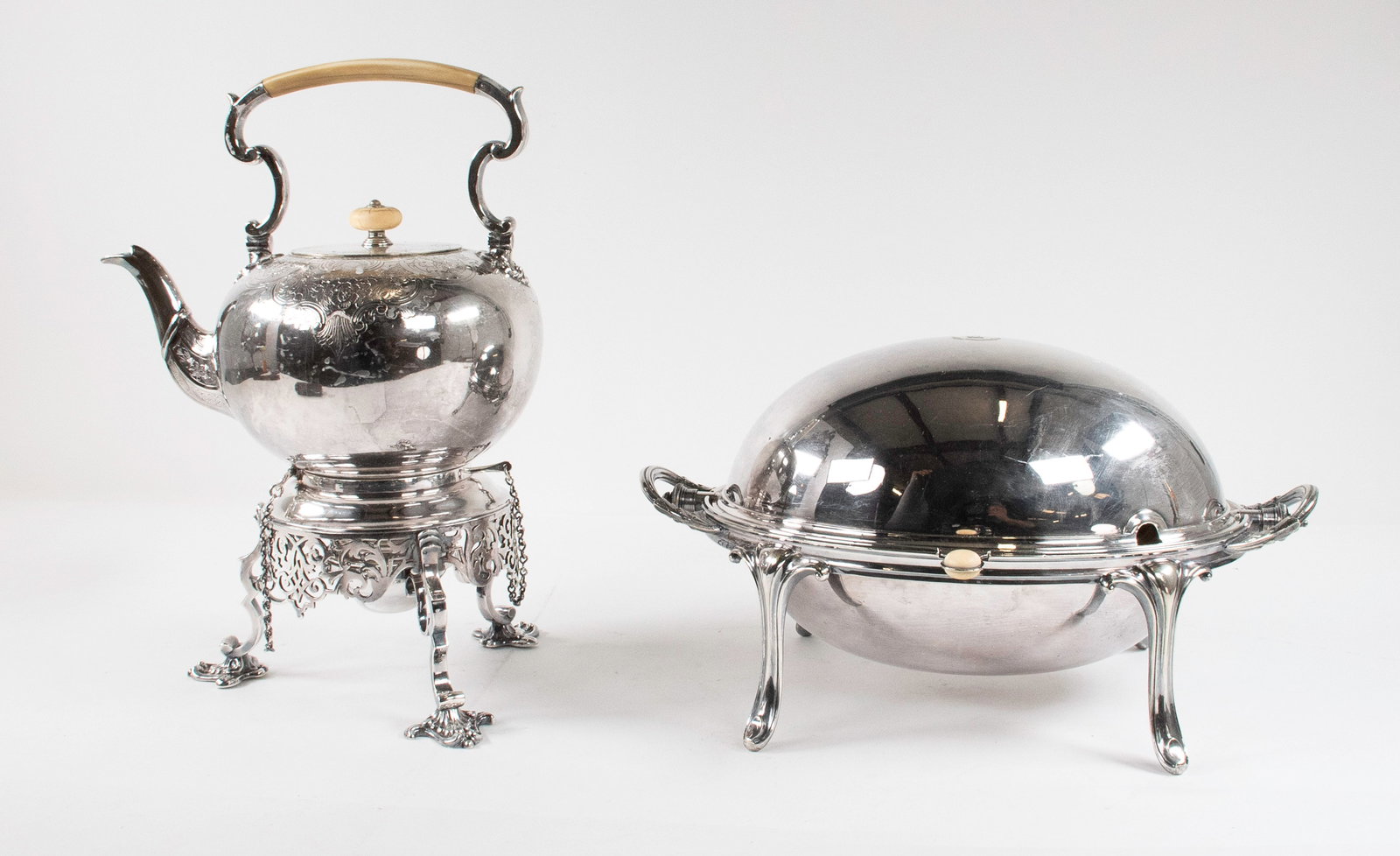 English Silverplate Kettle on Stand & Warmer: 19th century, silverplate tilting hot water kettle on warming stand, scrolled top handle with bone insert, hinged lid with bone finial, decorated with foliate scrolls and cartouches, stand with openwo