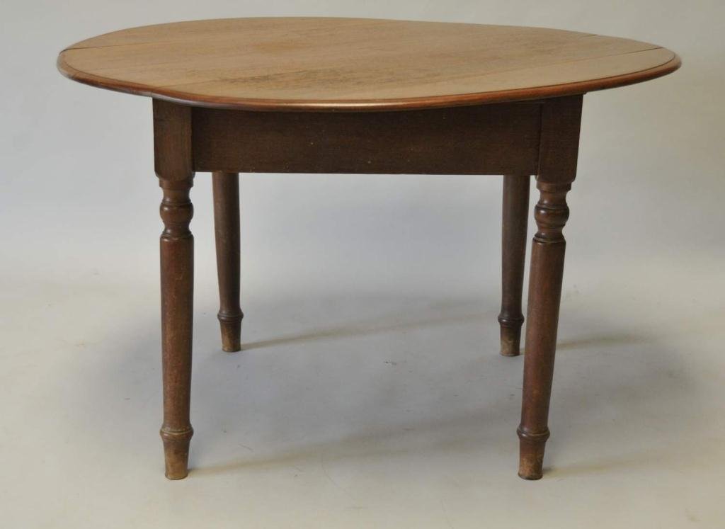 19th Century Country Walnut Breakfast Table: Round top with square-edged skirt, on turned legs; 49" x 48", 31"H--From the estate of Thomas A. Gandy, Society Hill, SC