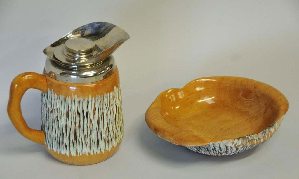 Aldo Tura for Macabo--Two Pieces of Bar Ware: Mid 20th century carved wood bowl and pitcher/carafe designed by Aldo Tura for Macabo, both stamped with logo "Macabo Cusano Milanino, Italy"; bowl 11 1/2" x 9", 3"H; carafe 8 3/4"H--From the estate o