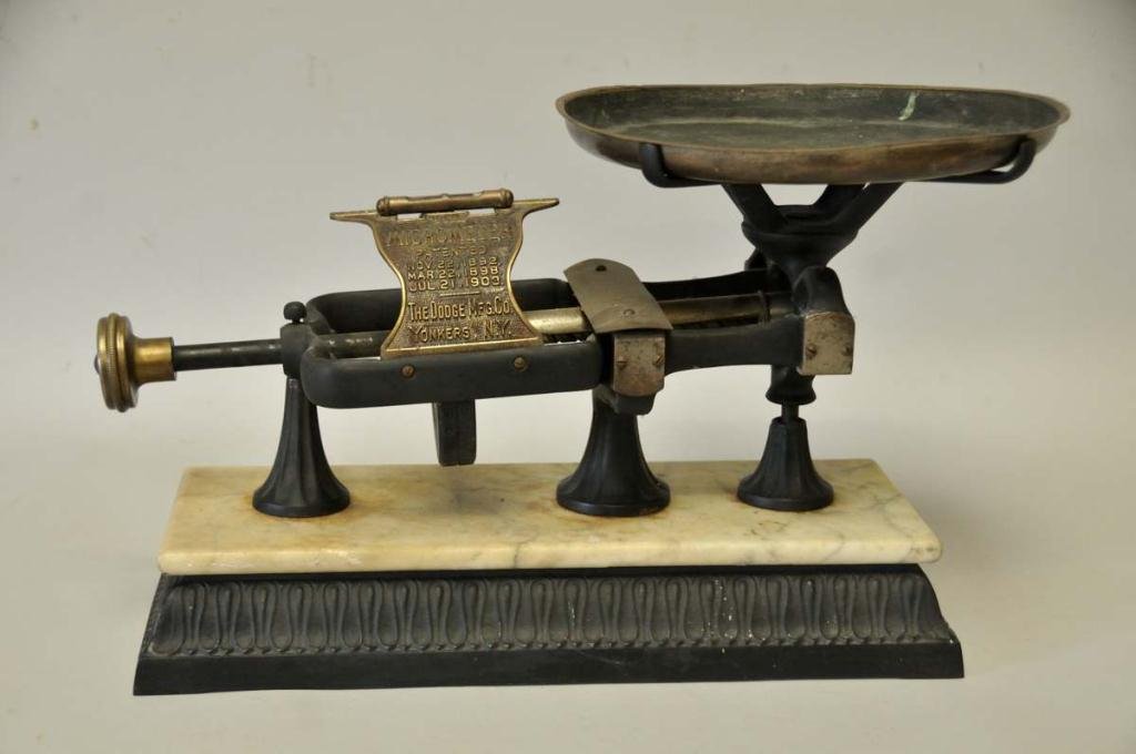 The Micrometer Countertop Country Store Scale: Cast iron, brass, and marble; manufactured by Dodge Mfg. Co., Yonkers, New York; patented 1892, 1898, 1903; 12"H, base 17 3/4" x 7 1/4"; dents to brass pan