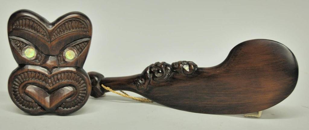 Maori, New Zealand, Carved Face Mask & Club: Two 20th century Maori wood carvings: 1. Face mask representing "He Weku", matai with paua shell eyes; 7"H, 5 1/2"W; 2. Flat form hand club with curved blade and figural carving on inner blade, styliz
