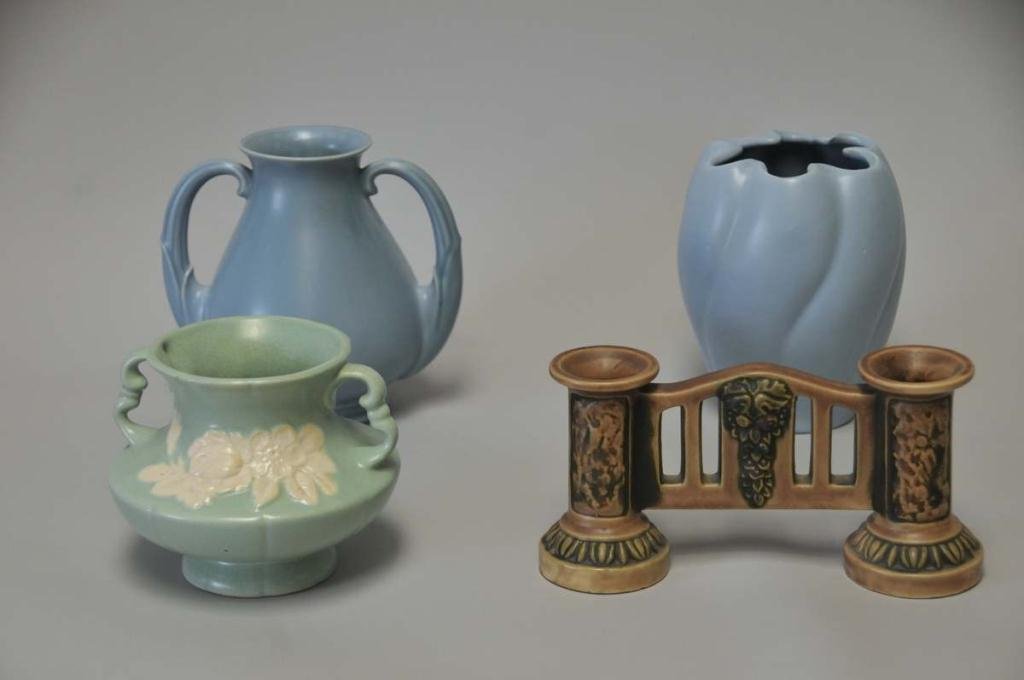 Four Pieces of American Art Pottery: 1. Roseville Florentine pattern double bud vase, unmarked; 9 1/4"W, 4 5/8"H; 2. Weller cameo double handled vase, green with white flowers, 5"H; crazing; 3. Blue Stangl No. 3111 double handled vase, 7