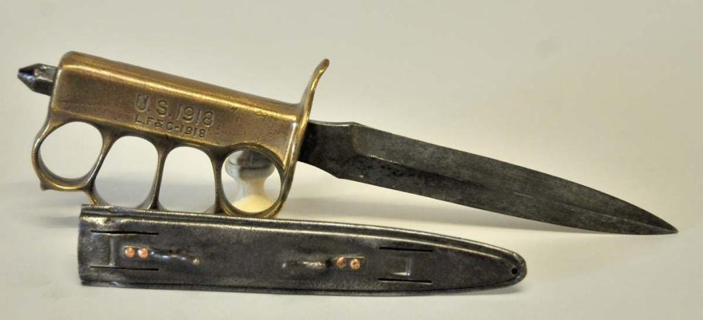 Landers, Frary & Clark U.S. 1918 Trench Knife: U.S. 1918 trench knife, brass knuckle grip, metal scabbard; grip incised "U.S. 1918 / L.F&C-1918", sheath incised "L.F.&C. / 1918"; 11 1/2"L overall; small dents to scabbard