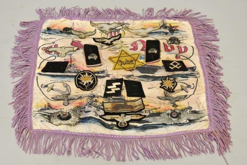 WWII U.S. Navy Pillow Sham w/ German Insignia: Veteran's square "U.S. Navy" pillow sham with pinned German metal insignia and stapled German cloth insignia, handwritten inscription verso "Sgt. W. Patterson / 487th Bomb Squad, 1945"; metal insignia