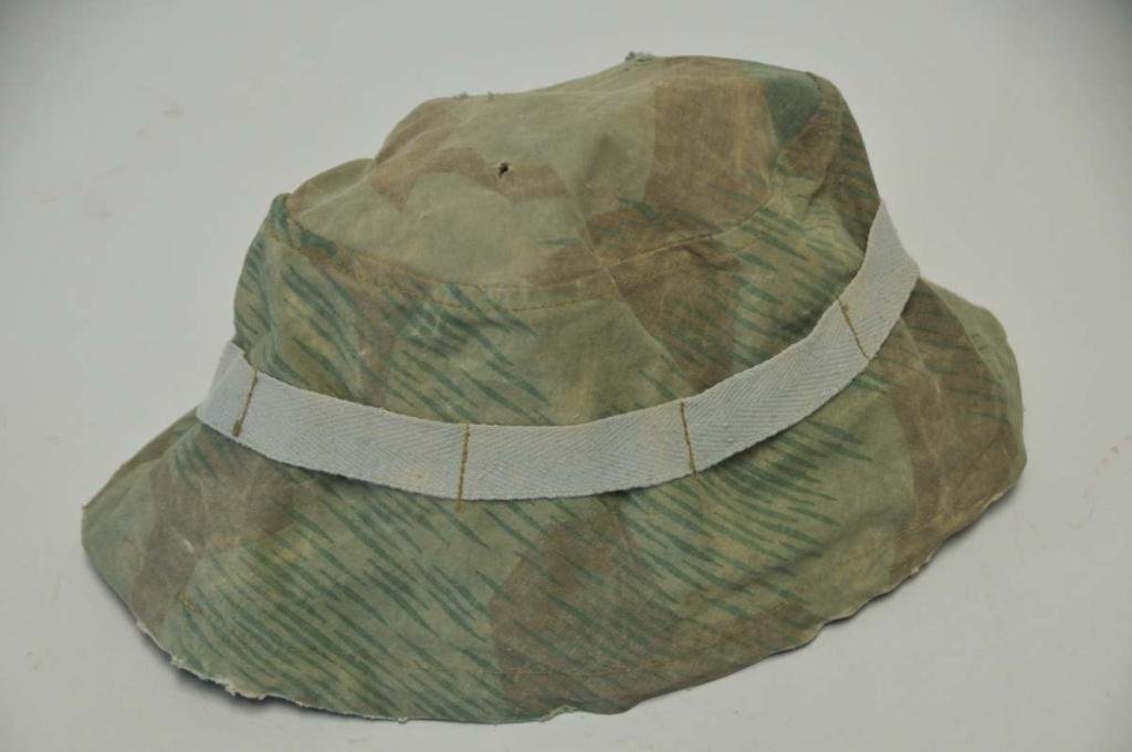 WWII German Camo Paratrooper Helmet Cover: Splinter pattern with original drawstring; wear to bottom edge, other wear commensurate with age and use, several small holes