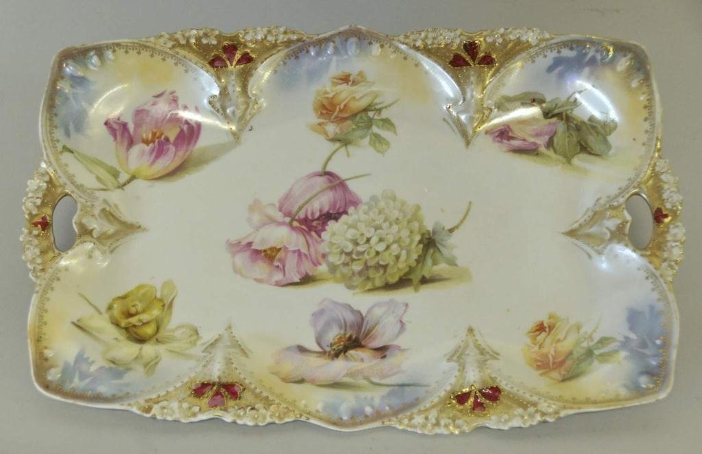 RS Prussia Porcelain Dresser Tray: Decorated with floral blooms and having iridescent trim, gilt beading and highlights, double handles, 7 3/4" x 11 3/4"--From the estate of Thomas A. Gandy, Society Hill, SC
