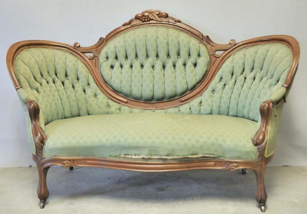 Renaissance Revival Carved Walnut Sofa: Fruit and leaf carved crest, tufted green damask upholstery; 69"W, 30"D, 43 1/2"H, seat height 17"; fading and soiling to upholstery--From the estate of Thomas A. Gandy, Society Hill, SC
