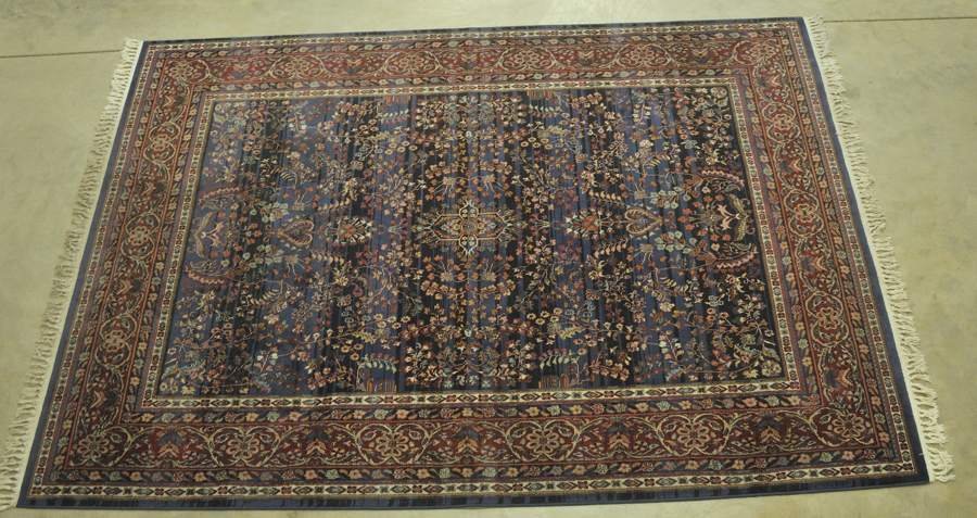 Oriental Style Rug: Machine made with hand knotted cotton fringe, late 20th century; 7'7"W, 8'3"L--From the estate of Thomas A. Gandy, Society Hill, SC