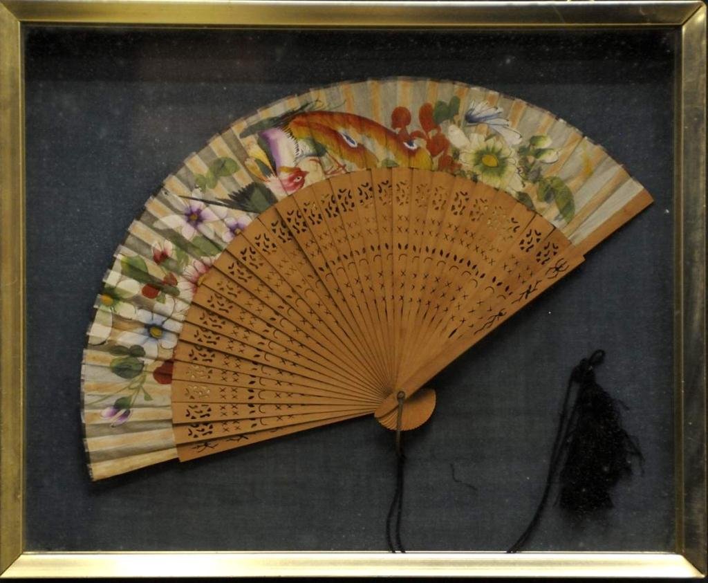 Victorian Folding Fan Mounted in Shadow Box Frame: Pierced wood ribs attach to paper fan decorated with bird and flowers, mounted in rectangular gilt metal shadow box frame with velvet backing; 13 1/2" x 11", 2 1/4"D; surface scratches to frame