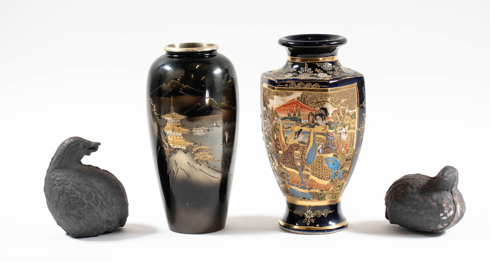 Two Signed Japanese Vases, Pair Cast Iron Quail: Four items: 1. Gilt and enameled Satsuma vase, hexagonal body, elaborately gilt-decorated and enameled with figures in garden landscapes on a black ground, raised on a circular foot, signed in red on