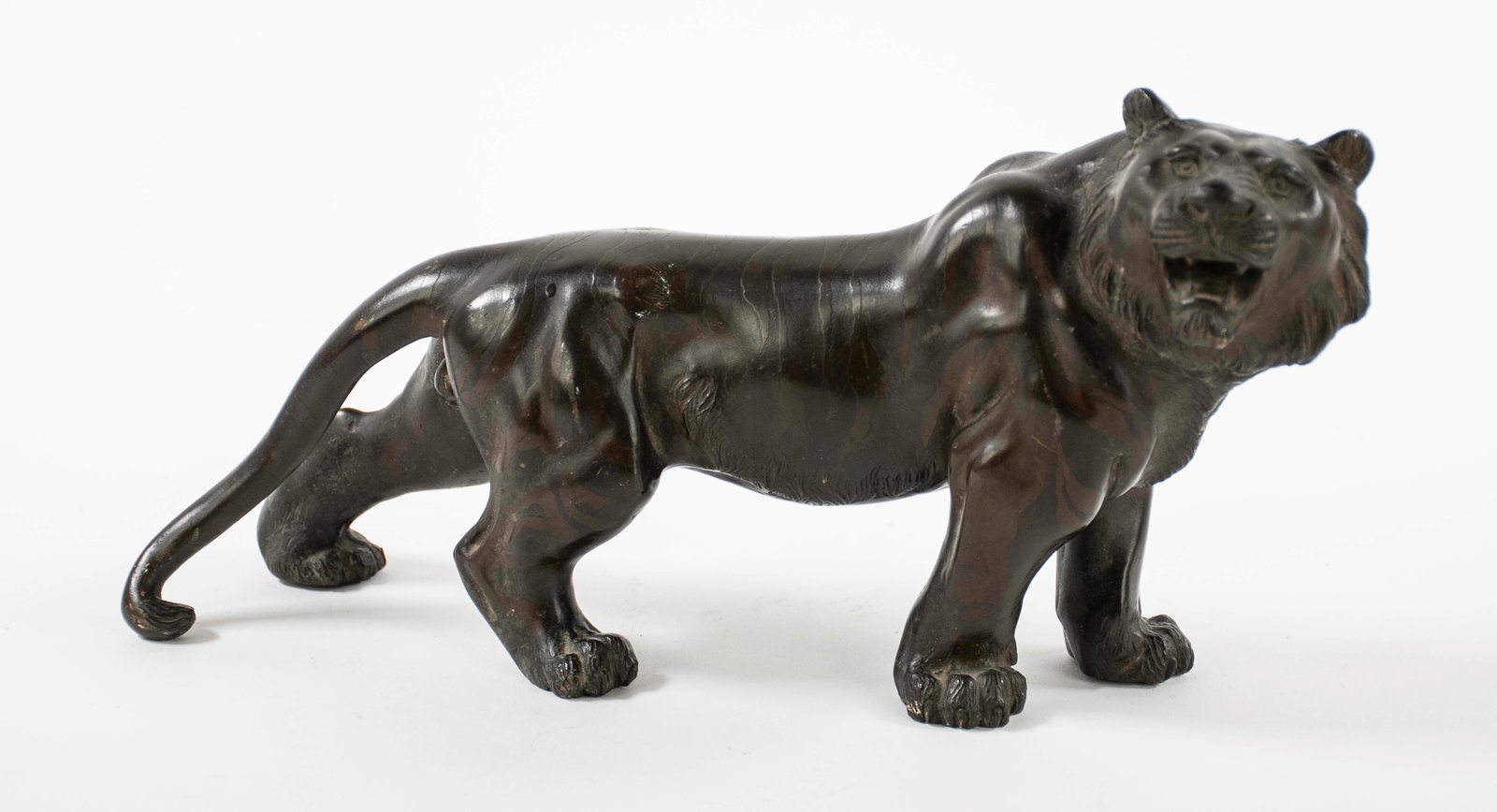 Signed Japanese Bronze Tiger: Signed on underside, likely Meiji Period; approx. 10 1/2"L, 5 1/2"H, 3 1/2"D; good condition (Inv. 2)