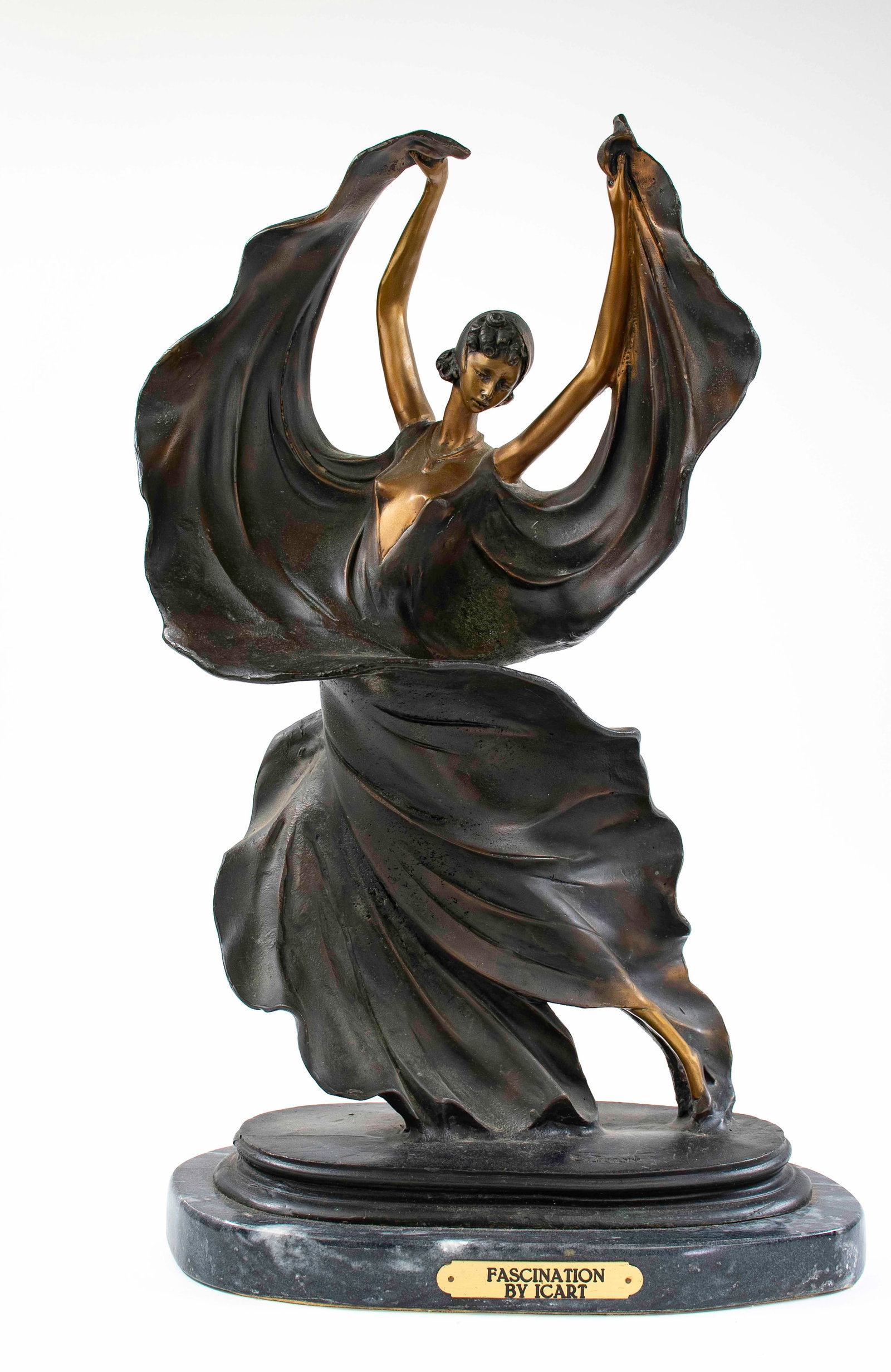 Bronze After Louis Icart (French, 1888-1950): "Fascination" depicting a dancer with arms raised overhead, signed in cast, mounted on a marble base; approx. 13" x 8", 20 1/2"H; good condition