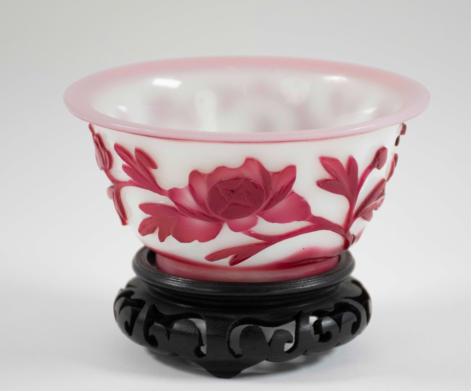 Chinese Red Peking Glass Bowl: Late 19th / early 20th century, ruby red on white with birds and flowering prunus branches, on pierced footed stand; 4 5/8" dia., 3 3/8"H with stand, 2 3/8"H without stand---good condition