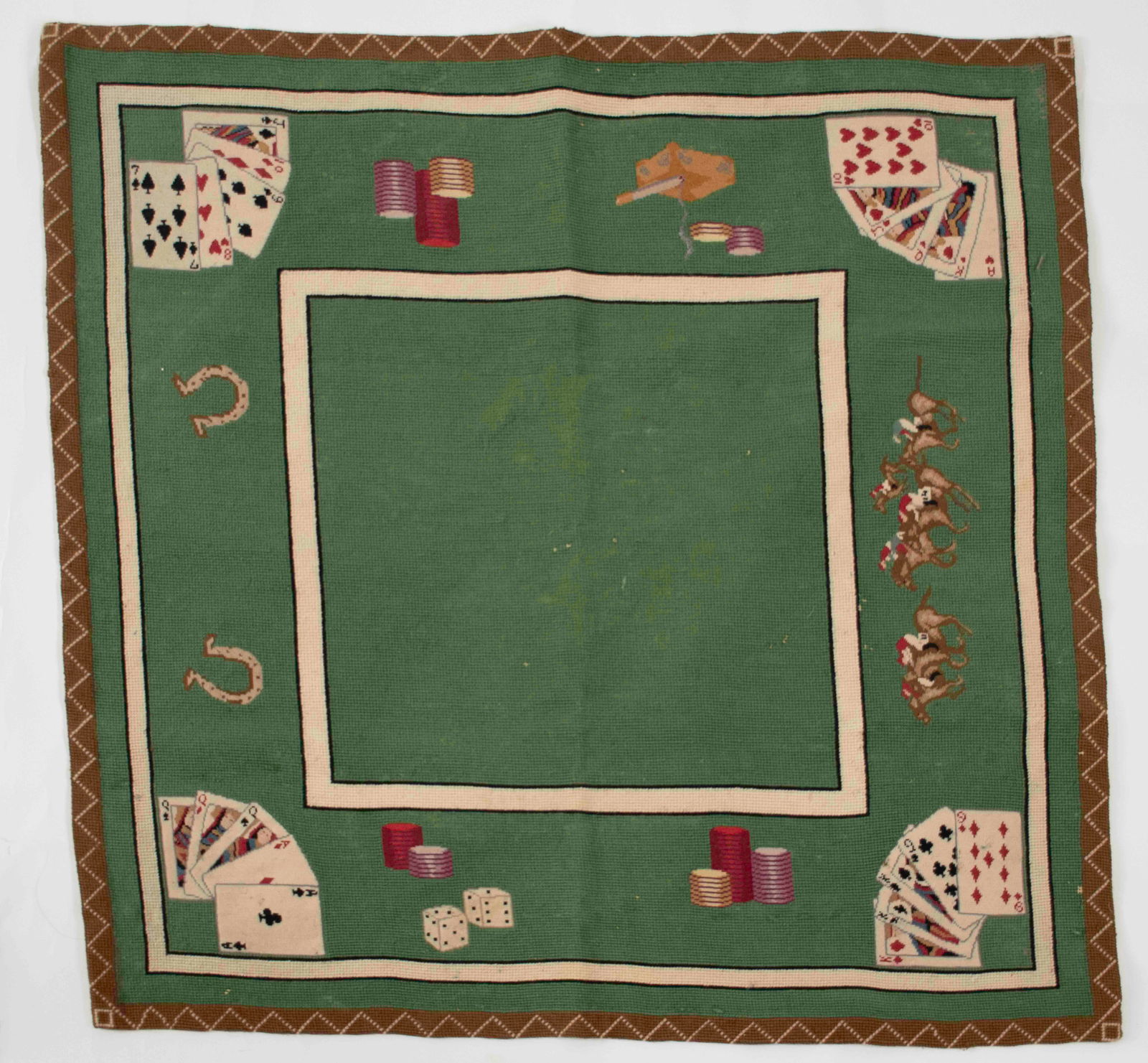 Vintage Game or Card Table Needlepoint Cover: Green needlepoint cover depicting poker hands at each corner, jockeys on horses racing on one side, horseshoes on one side, chips and dice on one side, chips and lit cigarette in ashtray on one side;