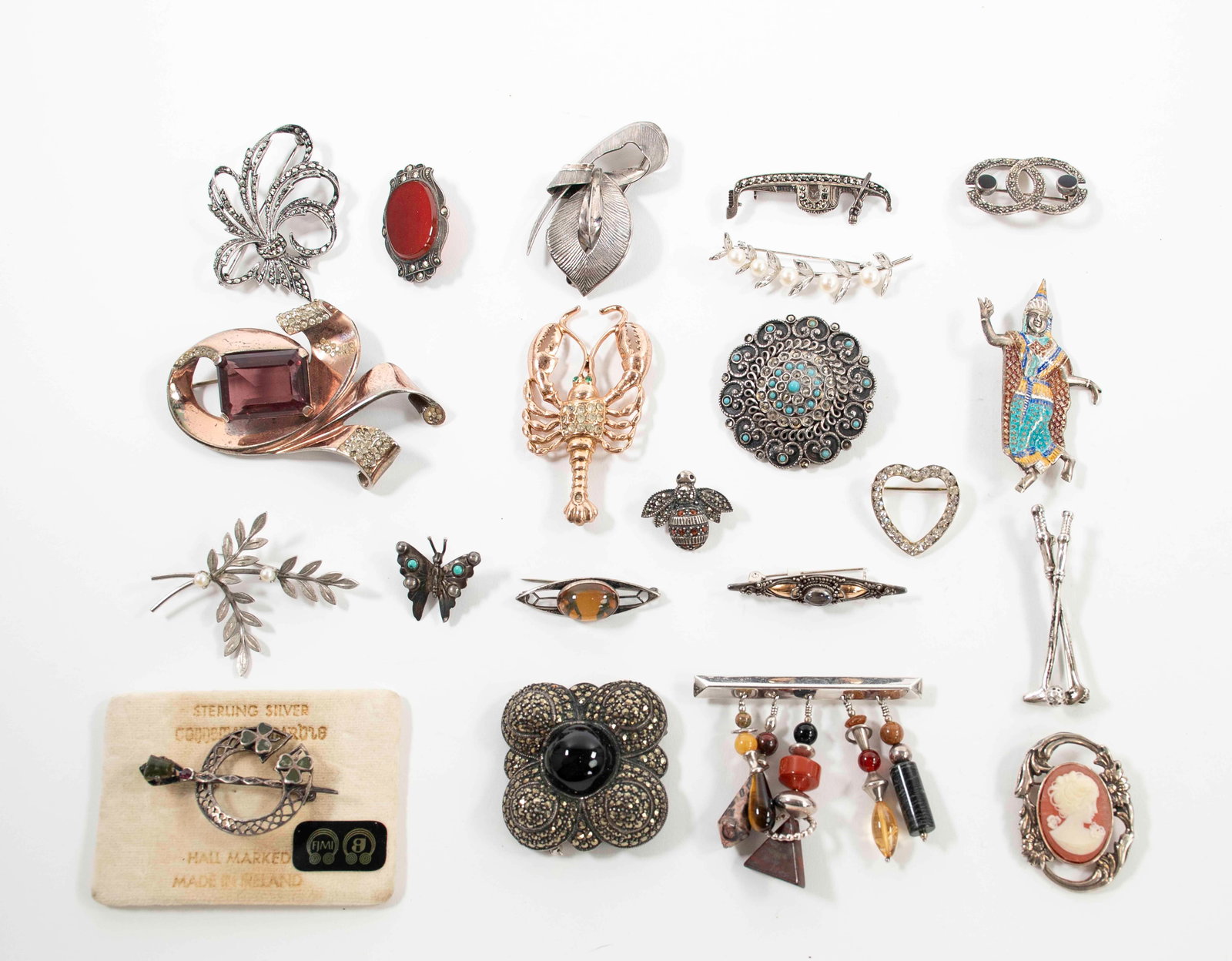 21 Sterling Silver Brooches: All marked "925" or "sterling"; other marks include Van Dell, West Germany, Hand Made in Greece / Skiathitis Rhodos, Germany, Siam, Irish hallmarks, and unknown maker's marks; various settings, two