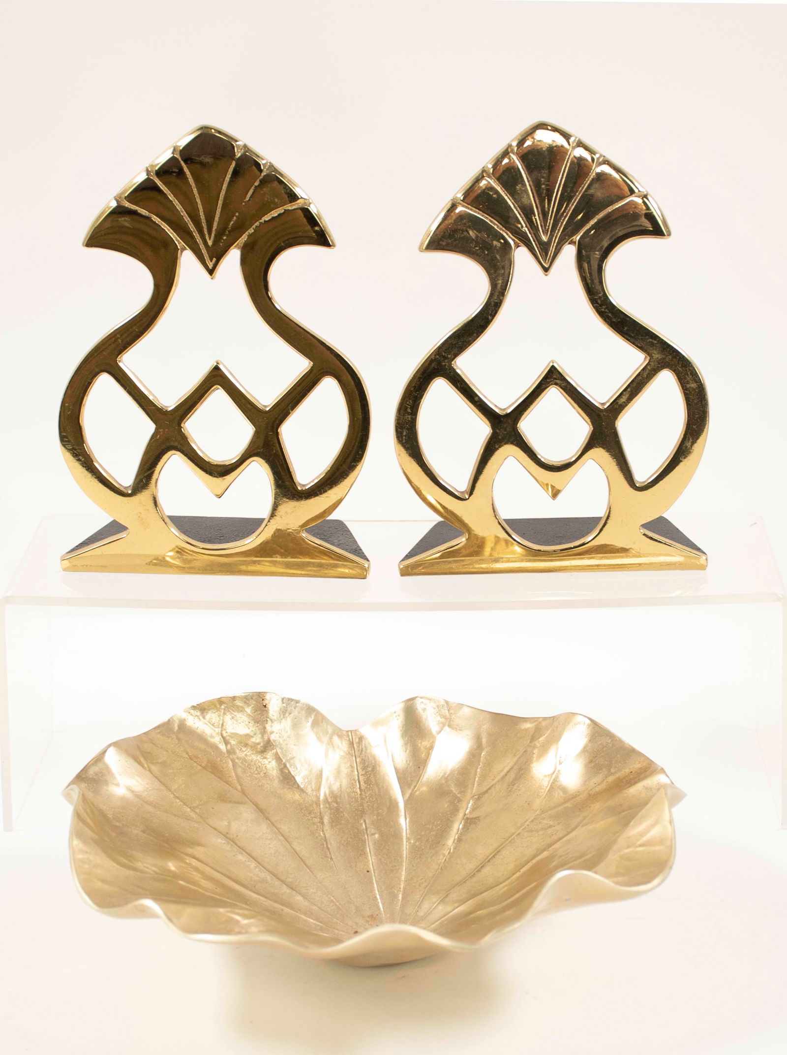 Harvin Lotus Bowl, Va. Metalcrafters Bookends: Lotus leaf bowl, anondized aluminum with brass finish, back marked "3517 / (Harvin logo) / Lotus / Small"; approx. 9" x 9", 2 5/8"H---Pair of Virginia Metalcrafters Historic Charleston brass bookends,