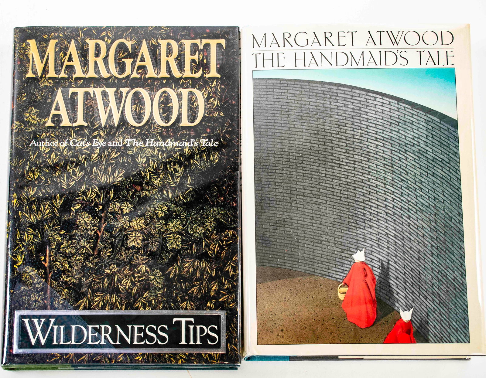 The Handmaid's Tale Signed 1st Edition: Two signed first edition books by Margaret Atwood: The Handmaid's Tale, 1986, signed by the author on half title page, with Houghton Mifflin bookcard, and Wilderness Tips, 1991, signed by the author