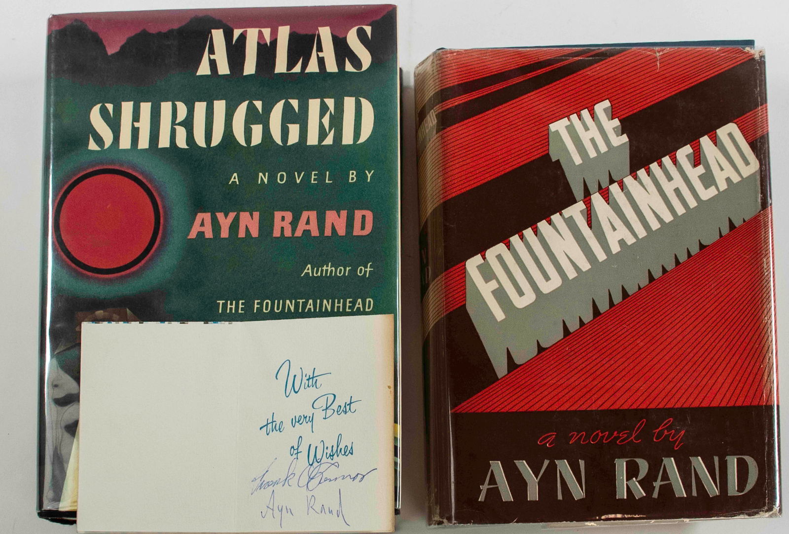 Ayn Rand Signed Gift Card with Two Books: Small card "A Gift for You" signed by Ayn Rand and her husband, Frank O'Connor, inside a copy of "The Fountainhead"; Bobbs-Merrill Co., 1943; later printing, NOT stated as first edition on copyright