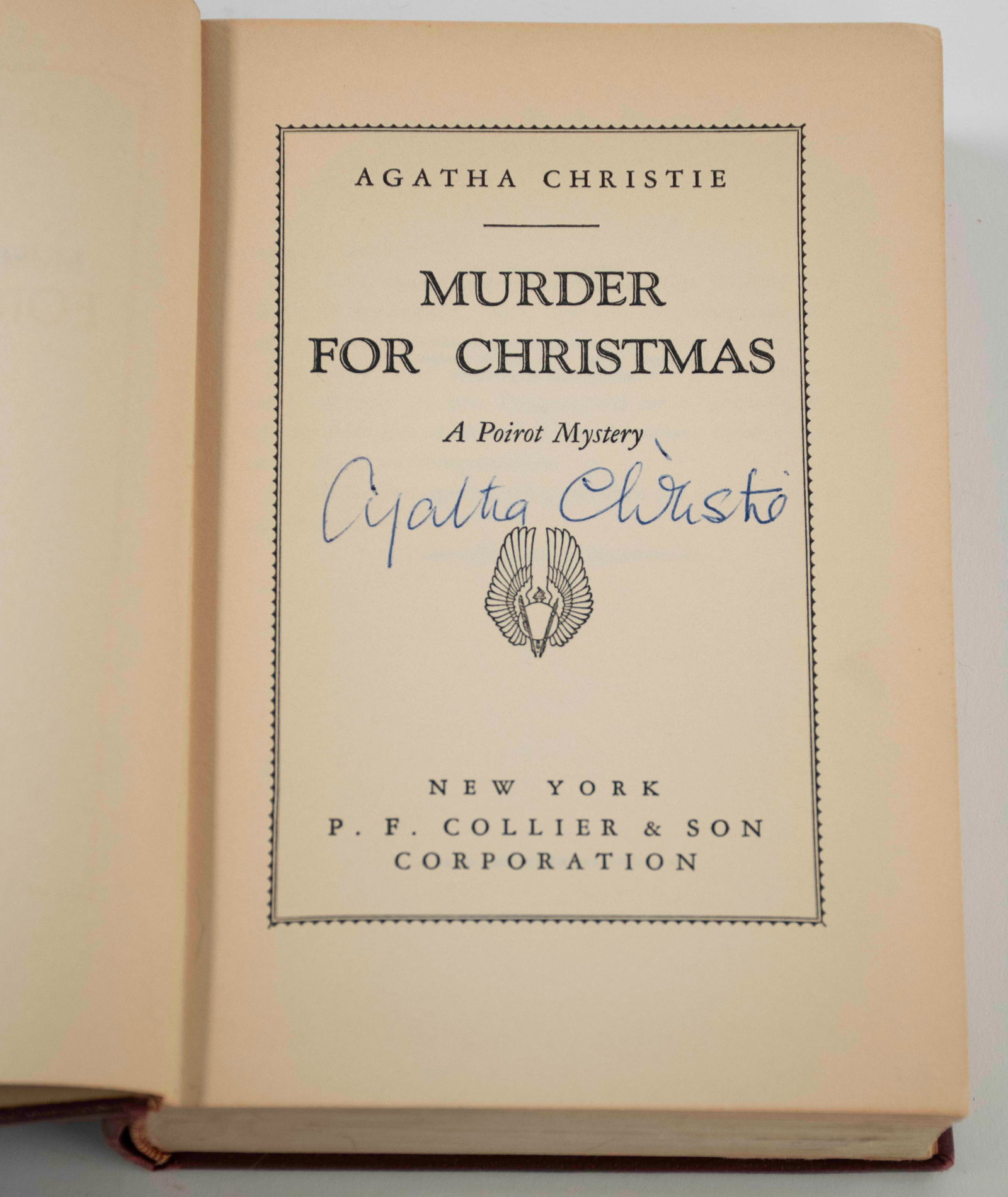 Signed Agatha Christie "Murder for Christmas": New York: P. F. Collier & Son, 1939; maroon hardcover with embossed creeping figures and footprints, gilt spine titles, signed by author on title page in blue ink, no dust jacket; some wear to top