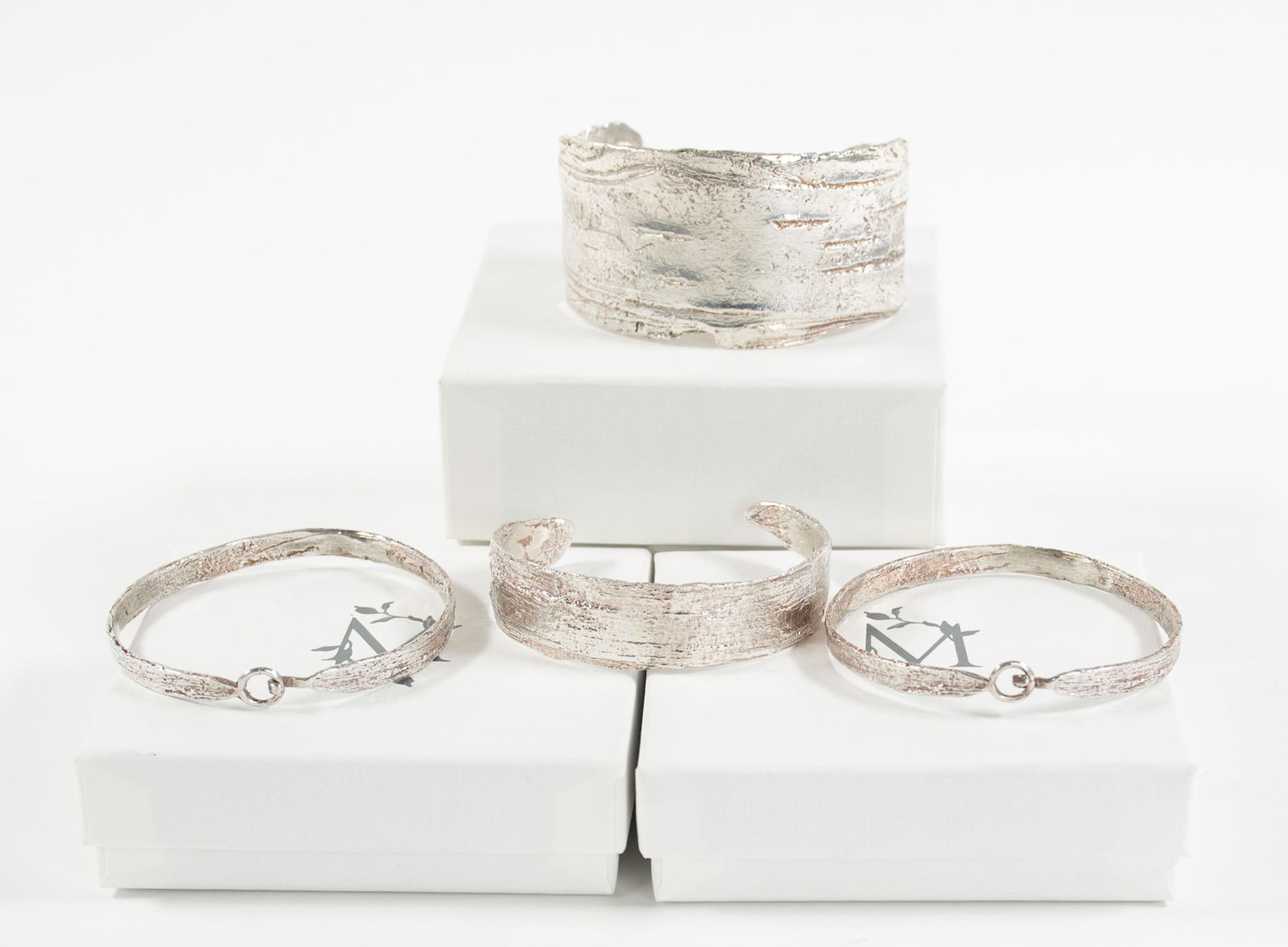 Mary Frances Maker, 4 Sterling Silver Bracelets: Four solid sterling silver bracelets by Mary Frances Maker, Atlanta, Georgia; archived birch bracelets directly cast from actual birch bark using the lost wax casting method; one cuff bracelet, 1 1/2"