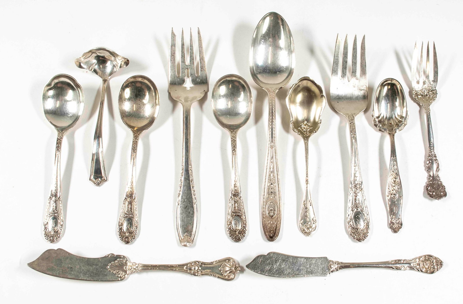 12 Pcs. Assorted Sterling Silver Flatware: Qualifies for in-house shipping---Two 6" soup spoons, 6" sugar spoon and 7 5/8" meat fork in Fontaine pattern by International Silver, each with engraved initial "B"---8 1/2" serving spoon in Wedgwood