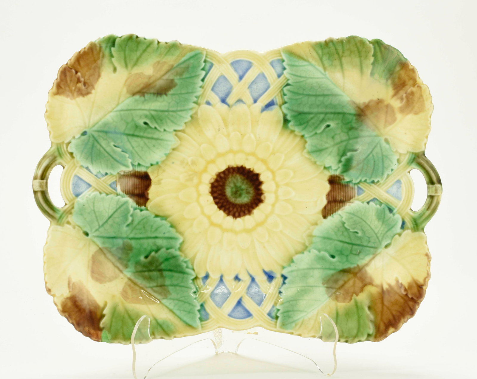Wedgwood Majolica Sunflower Platter: Qualifies for in-house shipping---19th century, colorful rectangular platter having green, yellow and brown leaves at each corner with yellow sunflower at center; yellow and blue lattice work at