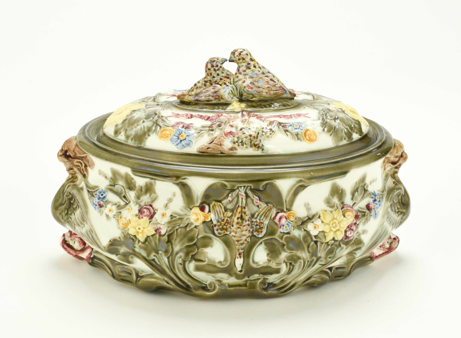 Wedgwood Majolica Partridge Pie Dish & Cover: Qualifies for in-house shipping---Oval white glazed body molded on each side with hanging game birds flanked by floral bouquets, green scroll decorations overall including around base rim, winged