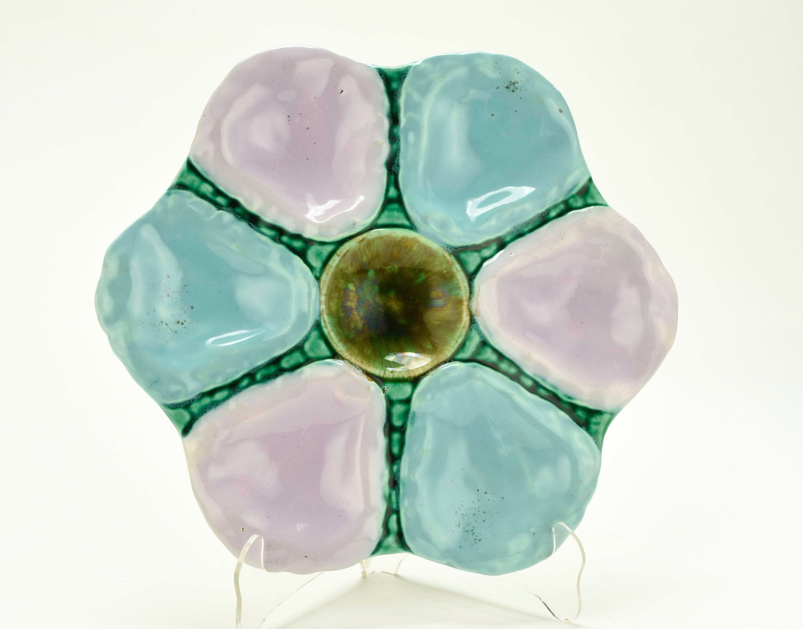 Majolica Oyster Plate: Qualifies for in-house shipping---Late 19th century, sxi oyster wells in alternating turquoise and violet, mottled green center well for sauce, underside in mottled green, marked "12" on base; 9