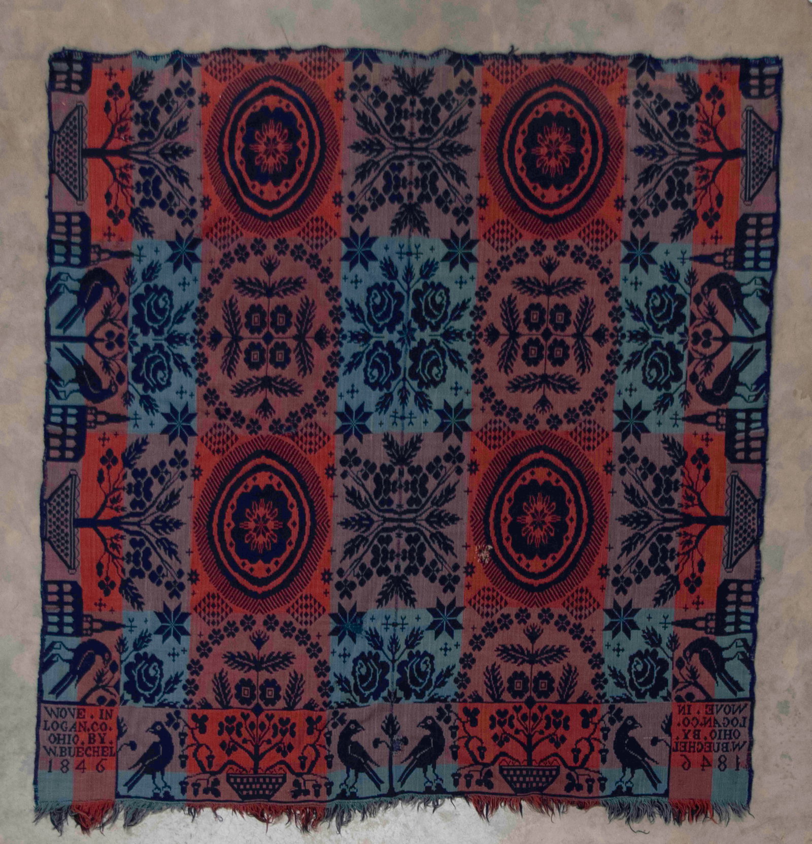 1846 Logan County, Ohio, Jacquard Coverlet: Qualifies for in-house shipping---Two-piece multicolored woven wool jacquard coverlet; borders decorated with birds, churches and pots of flowers; two corner blocks signed "Wove In Logan Co. Ohio By
