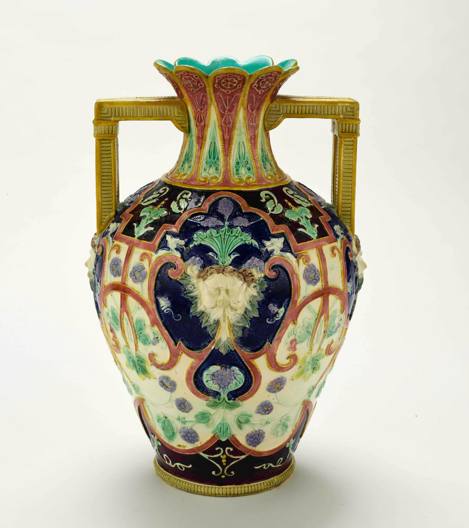 W. T. Copeland & Sons Raphaelesque Majolica Vase: Qualifies for in-house shipping---c. 1875, highly decorated Renaissance style vase with Bacchus heads, base impressed "Copeland"; approx. 11 1/8"H, 7 1/2"W; small glaze chip to inside top corner of