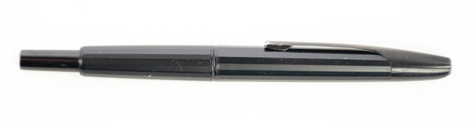 Namiki Vanishing Point Fountain Pen: Qualifies for in-house shipping---Namiki faceted Vanishing Point matte black fountain pen, nib marked "Namiki 14K 585 M A298"; 5 3/8"L; scattered light scratches commensurate with use---From the