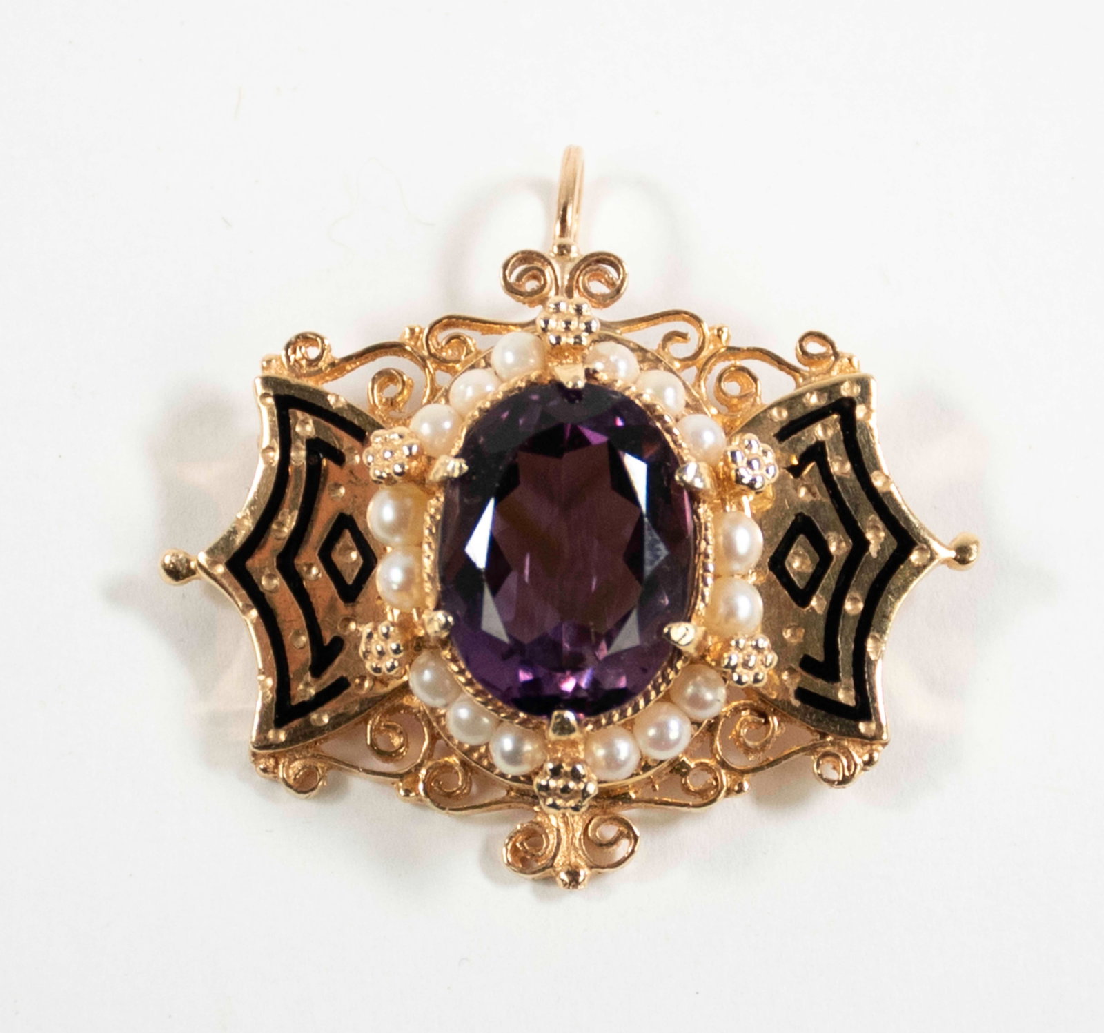 14K Victorian Style Amethyst Pendant / Brooch: Qualifies for in-house shipping---14K yellow gold pendant / brooch having an oval amethyst (15mm x 12mm), at center, surrounded by 16 2mm cultured pearls, black enameled accents to wing-like sides,